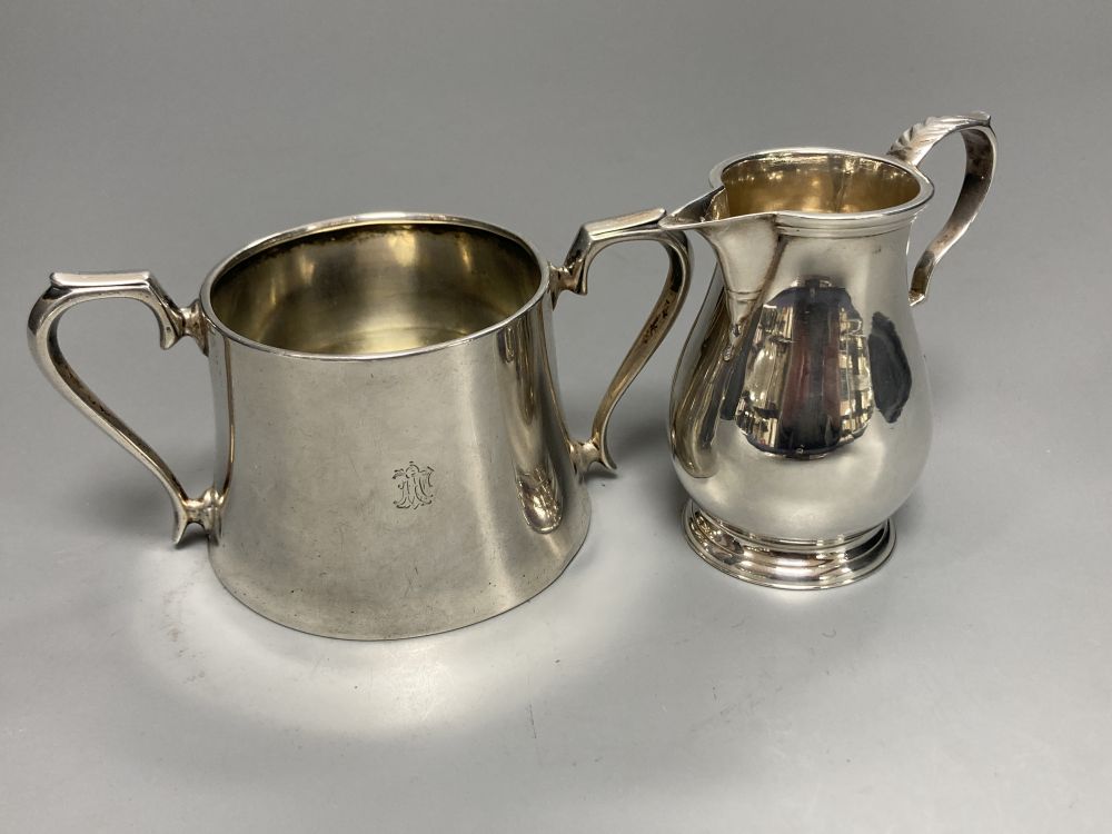 A George V Brittania standard silver sparrow beak cream jug, London, 1910 and an earlier silver two handled sugar bowl,